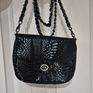 The limited black faux snake skin purse With Gunmetal Hardware